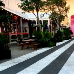 Large-scale white temporary paint stripes applied to the tarmac at Santa Monica Airport for the Frieze Los Angeles art fair.