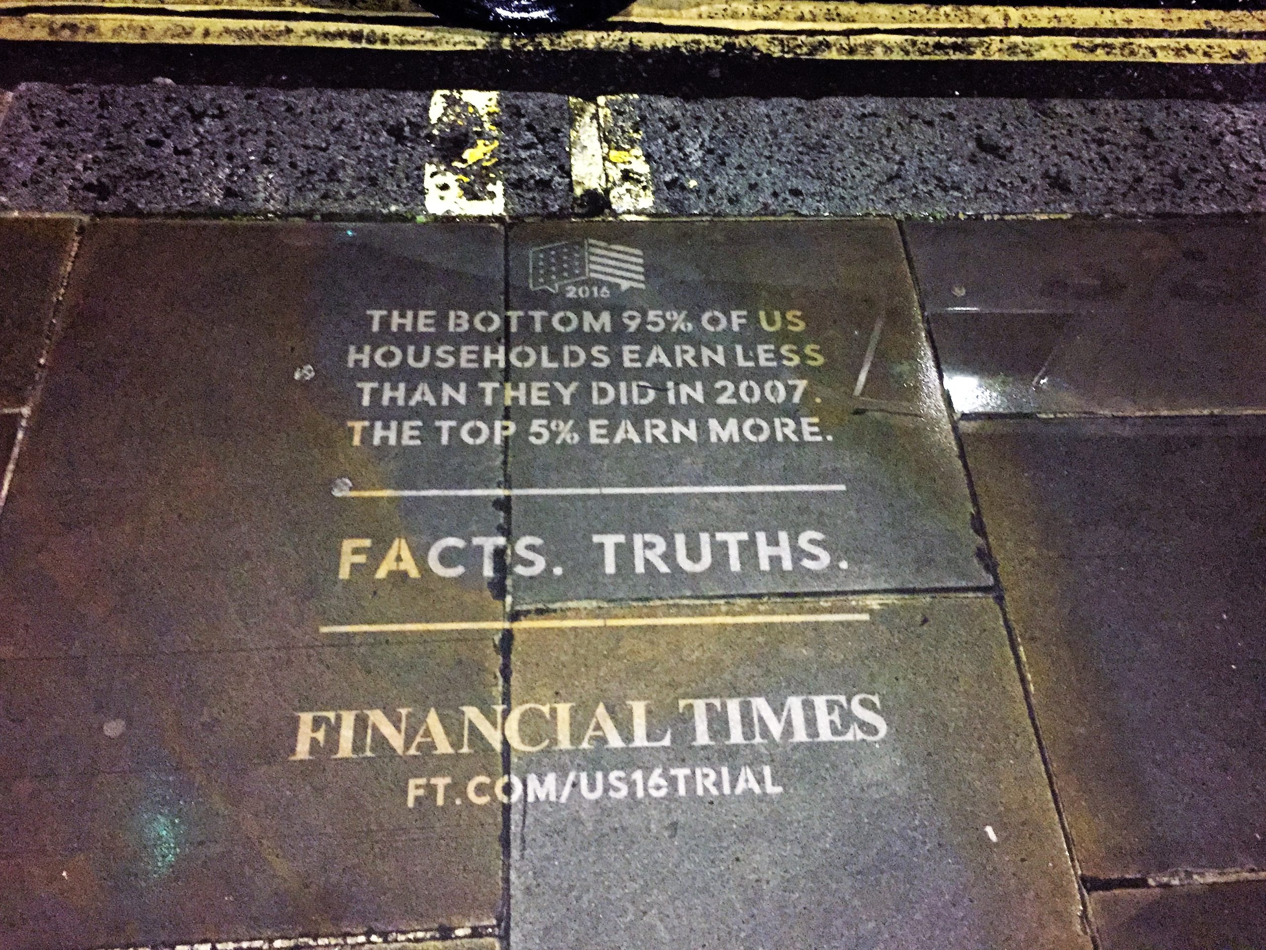 Clean advertising reverse graffiti stencil for the Financial Times, reading 'Facts. Truths.', cleaned into a dark pavement surface at night.